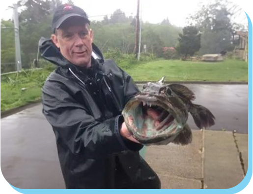 A man holding a fish in his hands.