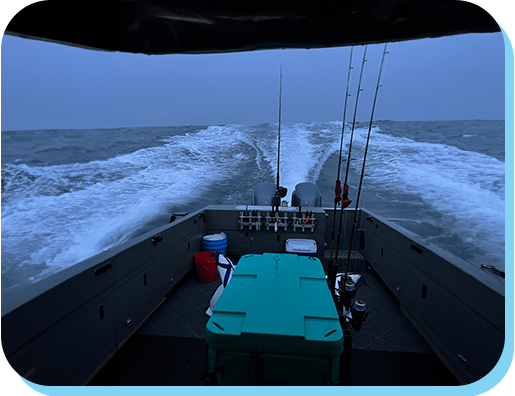 A boat with fishing rods on the water.