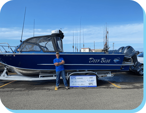 A man standing in front of a boat.